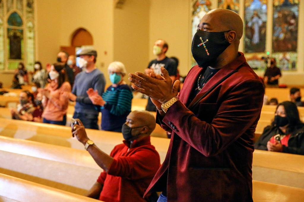 Melvin Darby claps to the music of the MLK Celebration Ensemble during the Greater Everett Area Rev. Dr. Martin Luther King, Jr. Community Celebration at the First Presbyterian Church of Everett. (Kevin Clark / The Herald)