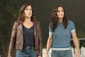 This image released by Paramount Pictures shows Neve Campbell, left, and Courteney Cox in a scene from "Scream." (Brownie Harris/Paramount Pictures via AP)