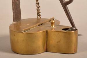 Photo Caption: This antique Betty lamp was made by a known craftsman of the early 1800s, so it is very expensive: $2,000. You can find old Betty lamps for sale for less than $100 if they are in poor condition.

(c) 2022 by Cowles Syndicate Inc.