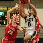 Elijah Johnson (right) had another big game for the Scots with 20 points and a number of assists. (Kevin Clark / The Herald)