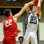 Stanwoods Mack Hepper adds pressure to a shot attempt by Shorecrests Parker Baumann Thursday evening at Shorecrest High School in Shoreline, Washington on January 13, 2022. The Highlanders won 88-68. (Kevin Clark / The Herald)