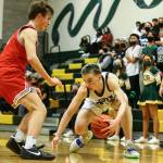 Shorecrest's Parker Baumann gathers a loose dribble with Stanwood's John Floyd defending Thursday evening at Shorecrest High School in Shoreline, Washington on January 13, 2022. The Highlanders won 88-68. (Kevin Clark / The Herald)