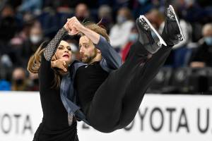 Kaitlin Hawayek and Jean-Luc Baker compete in the rhythm dance program during the U.S. Figure Skating Championships Friday, Jan. 7, 2022, in Nashville, Tenn. (AP Photo/Mark Zaleski)