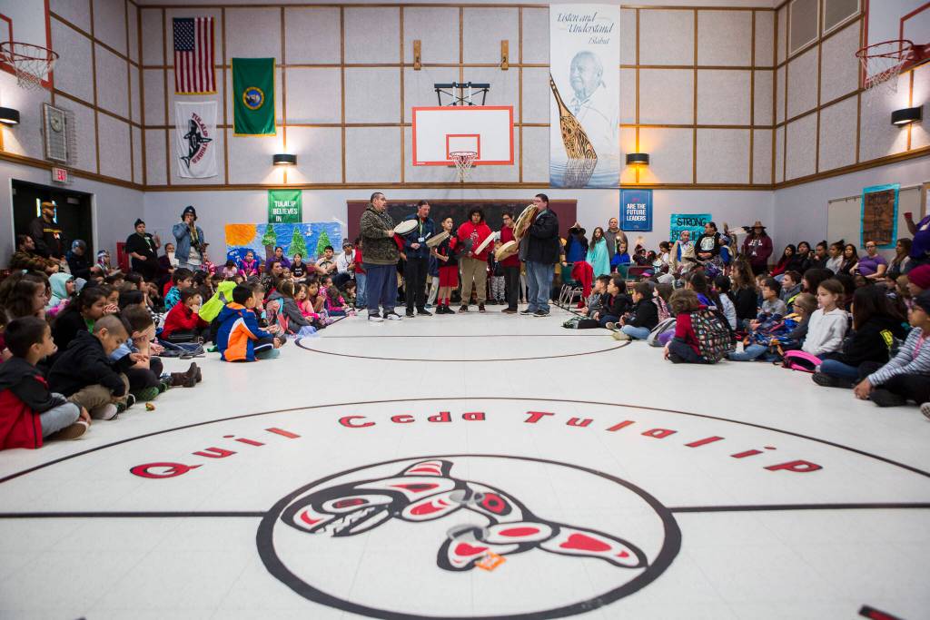 Guest drummers perform at an assembly during Tulalip Day at Quil Ceda Tulalip Elementary on Nov. 27, 2019. (Olivia Vanni / Herald file)