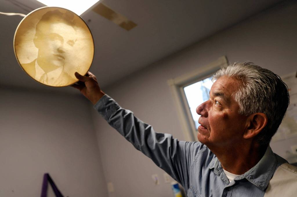 Les Parks shows off one of his laser-etched products Tuesday afternoon at his home in Tulalip. (Kevin Clark / The Herald)