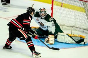 Portland's Gabe Klaassen makes a goal past Everett's Koen MacInnes to win in the penalty shootout Saturday evening at the Angel of the Winds Arena on January 1, 2022. (Kevin Clark / The Herald)
