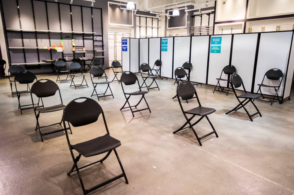 The waiting area inside the new free COVID-19 vaccination site at the Everett Mall. (Olivia Vanni / The Herald)