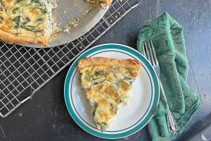 This easy-to-make spinach and mushroom quiche is perfect for a light dinner or fancy brunch. (Gretchen McKay/Pittsburgh Post-Gazette/TNS)