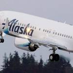 FILE - In this Monday, March 1, 2021 file photo, The first Alaska Airlines passenger flight on a Boeing 737-9 Max airplane takes off on a flight to San Diego from Seattle-Tacoma International Airport in Seattle. A Boeing pilot involved in testing the 737 Max jetliner was indicted Thursday, Oct. 14,2021 by a federal grand jury on charges of deceiving safety regulators who were evaluating the plane, which was later involved in two deadly crashes. (AP Photo/Ted S. Warren, File)
