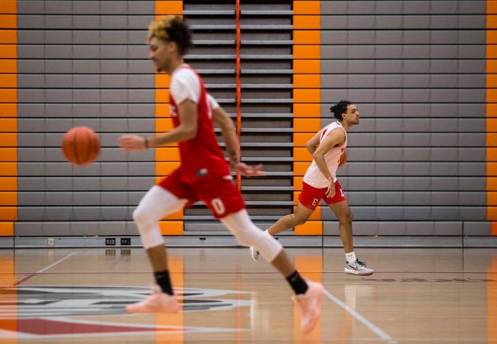 Leon Sayers and Raefe McEnroe warm up during practice Monday in Everett. (Olivia Vanni / The Herald)