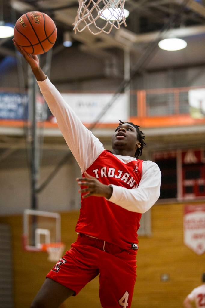Edwin Bouah makes a layup during practice Monday in Everett. (Olivia Vanni / The Herald)