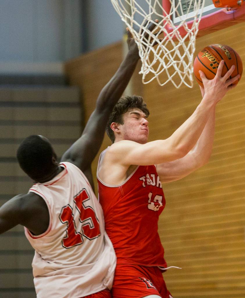 Cam Millican attempts a layup during practice Monday in Everett. (Olivia Vanni / The Herald)