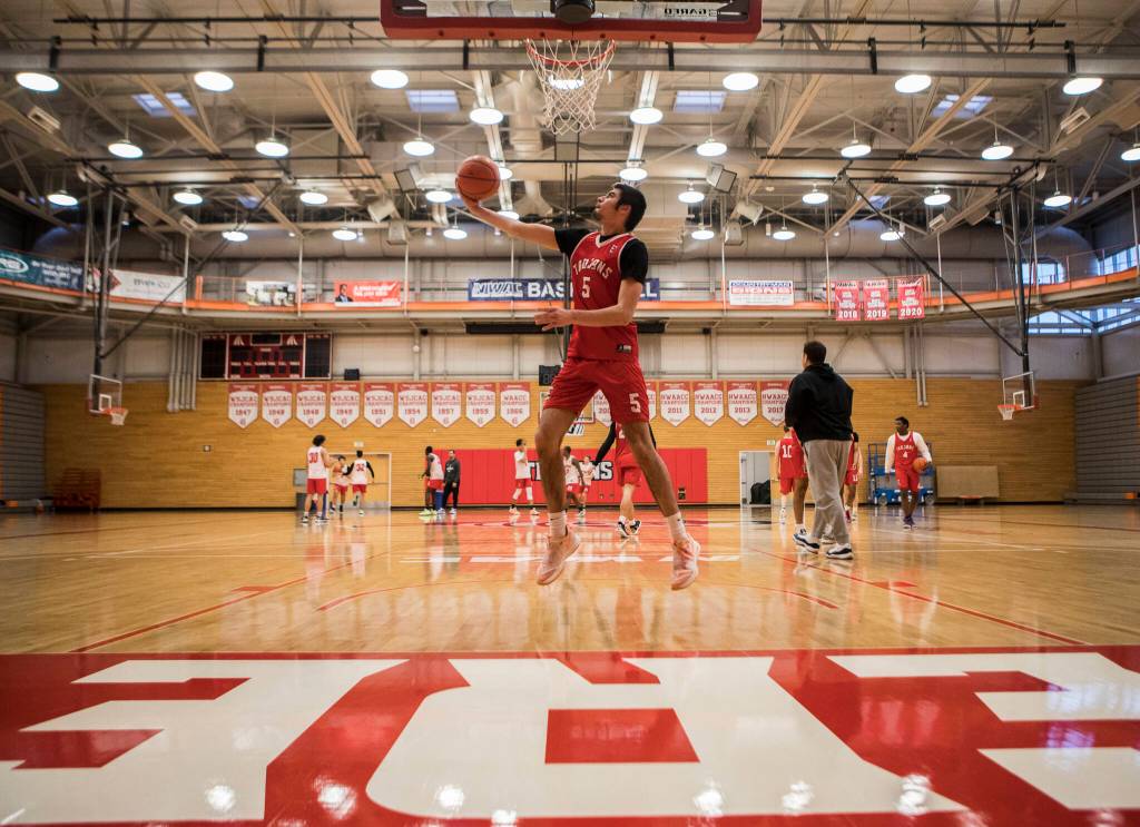 Tucker Molina makes a layup during practice Monday in Everett. (Olivia Vanni / The Herald)