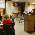 Justin Kang addresses the Mukilteo School Board Monday evening. Kang, and other teachers of the school district, urged the board to no longer require To Kill A Mockingbird for ninth-graders. (Kevin Clark / The Herald)
