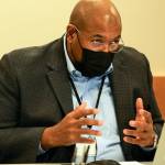 Michael Simmons, president of the Mukilteo School Board, discusses To Kill A Mockingbird Monday evening. (Kevin Clark / The Herald)