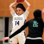 Lake Stevens Baylor Thomas looks to pass with Jacksons Giselle Dogan defending Saturday evening at Lake Stevens High School. (Kevin Clark / The Herald)