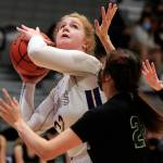Lake Stevens Cori Wilcox looks to shoot with Jacksons Arielle Leavens defending Saturday evening at Lake Stevens High School. (Kevin Clark / The Herald)
