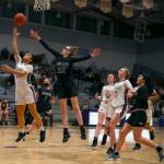 Lake Stevens Baylor Thomas attempts a layup past the outstretched arm of Jacksons Hannah Mack on Saturday evening at Lake Stevens High School. (Kevin Clark / The Herald)