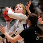 Lake Stevens' Cori Wilcox looks to shoot with Jackson's Arielle Leavens defending Saturday evening at Lake Stevens High School in Lake Stevens, Washington, January 22, 2022. (Kevin Clark / The Herald)