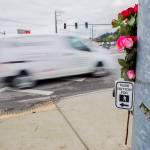 Flowers have been placed as a makeshift memorial for two pedestrians killed at the corner of 204th Street NE and Highway 9 in Arlington. (Olivia Vanni / The Herald)