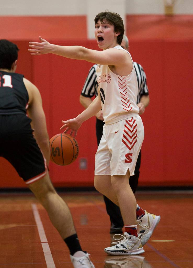 Stanwoods Owen Thayer yells out a play during Thursdays game in Stanwood. (Olivia Vanni / The Herald)