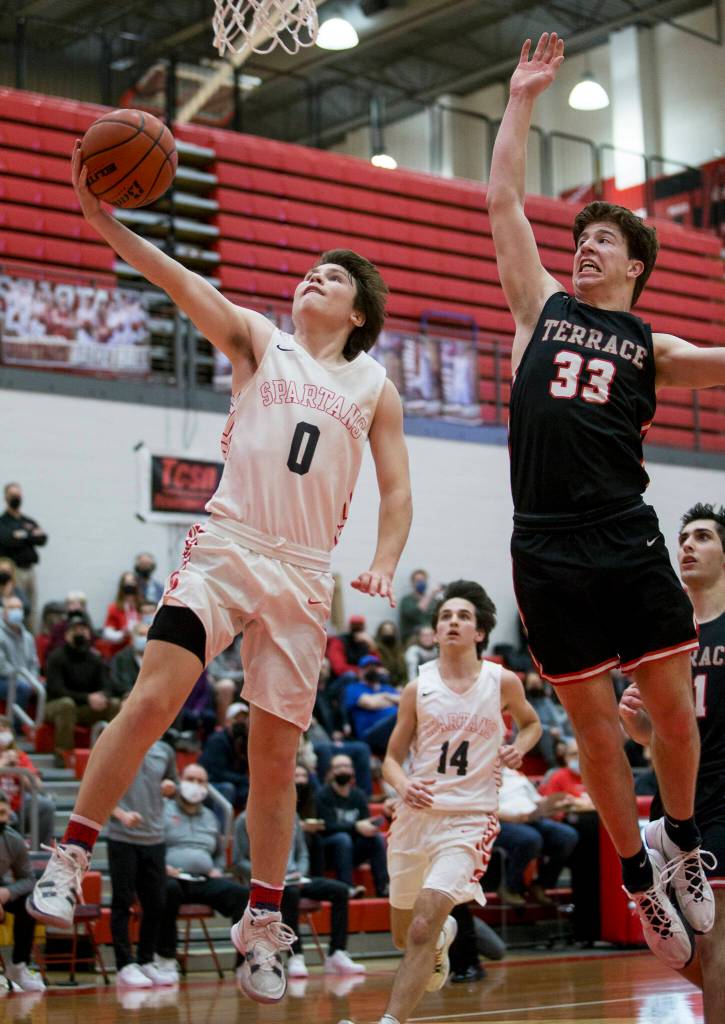 Stanwoods Owen Thayer makes a layup during Thursdays game in Stanwood. (Olivia Vanni / The Herald)