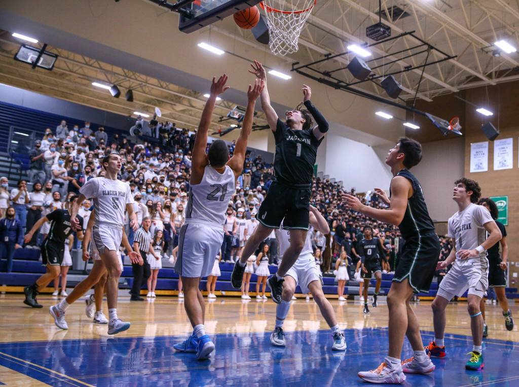 Jacksons Drilon Veliu attempts a shot through Glacier Peaks defense Friday evening at Glacier Peak High School in Snohomish, Washington on January 21, 2022. The Grizzles won 57-54. (Kevin Clark / The Herald)