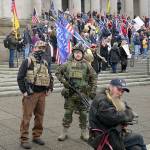 Two armed men at a protest supporting President Donald Trump on Jan. 6, 2021, at the Capitol in Olympia. (AP Photo/Ted S. Warren, File)
