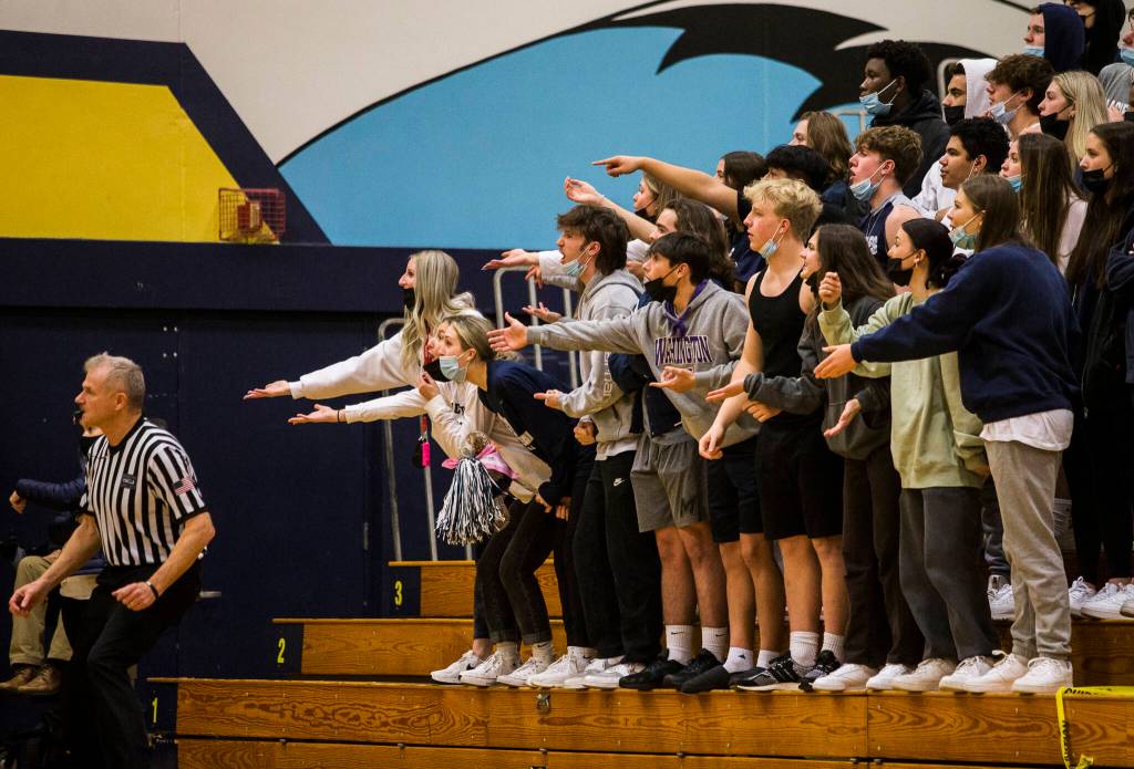 The Glacier Peak student section reacts to a call by the referee during the game against Mariner on Tuesday, Jan. 25, 2022 in Everett, Washington. (Olivia Vanni / The Herald)