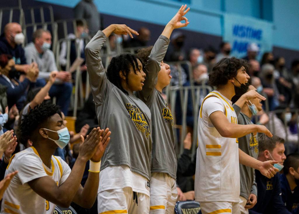 The Mariner bench reacts to a three point shot during the game against Glacier Peak on Tuesday, Jan. 25, 2022 in Everett, Washington. (Olivia Vanni / The Herald)
