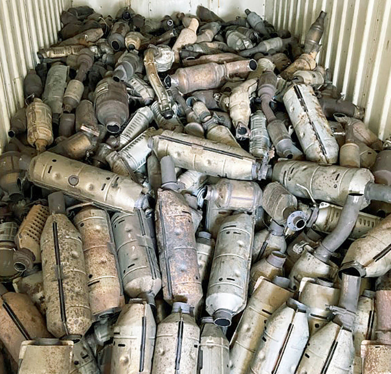 During a June 2021 bust, Kent police recovered nearly 800 catalytic converters, seized about $40,000 in cash and arrested multiple suspects after a lengthy investigation into numerous thefts. (Kent Police Department)