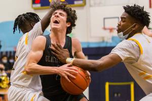 Glacier Peak's Aidan Davis is yells while being fouled by Mariner's Dakota Joseph during the game on Tuesday, Jan. 25, 2022 in Everett, Washington. (Olivia Vanni / The Herald)