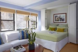 This image provided by Higgins Design Studio shows an open Murphy bed. (Mentis Photography/Higgins Design Studio via AP)