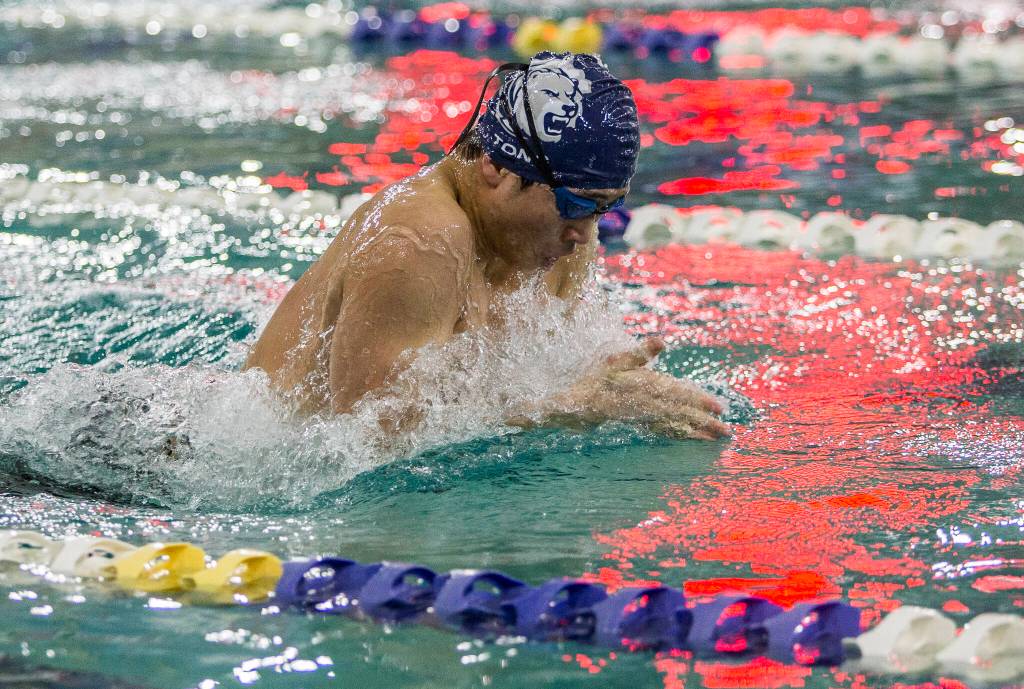 Glacier Peaks Shouei Tong races in the 100-yard breastroke during a swim meet again Lake Stevens and Snohomish on Thursday in Snohomish. (Olivia Vanni / The Herald)