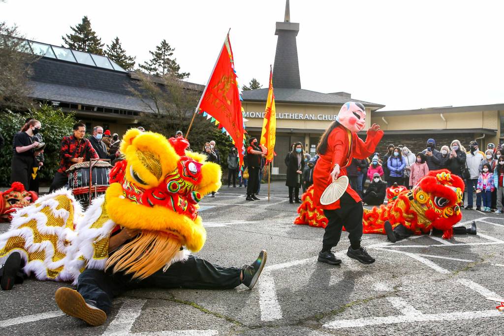 Members of Master David F. Leong Dragon and Lion Dance Group bring in the Lunar New Year at Edmonds Lutheran Church on Saturday. (Kevin Clark / The Herald)
