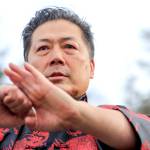 David Leong salutes the audience after his team performs a lion dance to bring in the Lunar New Year in Edmonds on Saturday. (Kevin Clark / The Herald)
