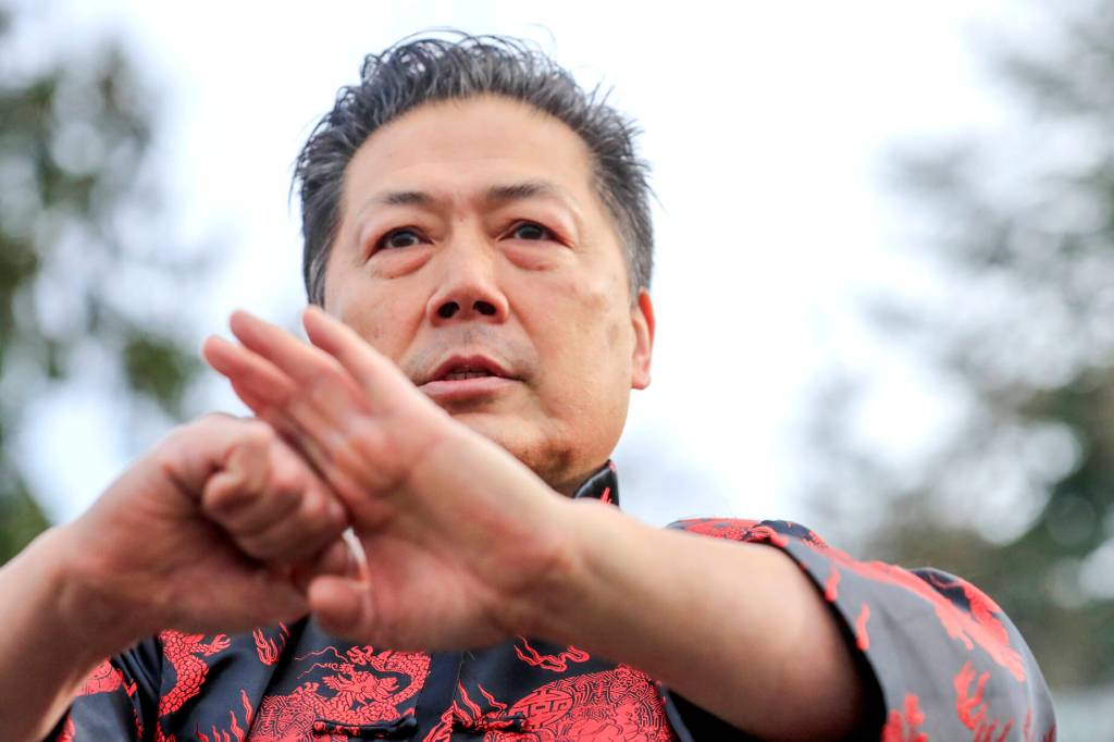 David Leong salutes the audience after his team performs a lion dance to bring in the Lunar New Year in Edmonds on Saturday. (Kevin Clark / The Herald)