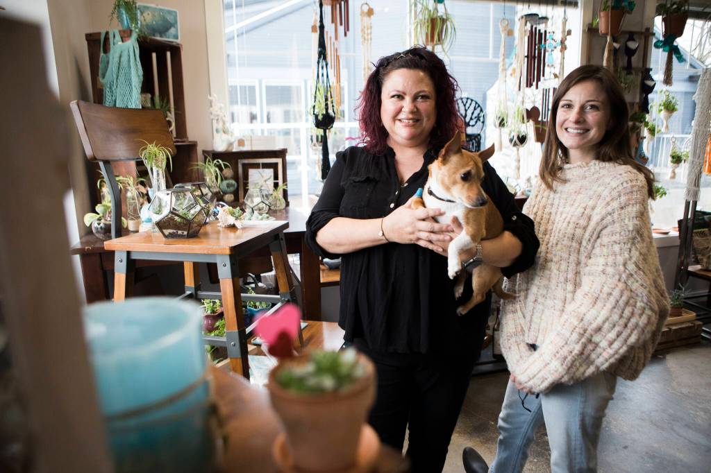 Monkey First Market owner Khristina Hernandez (left) and employee Samantha Holbrook. (Olivia Vanni / The Herald)