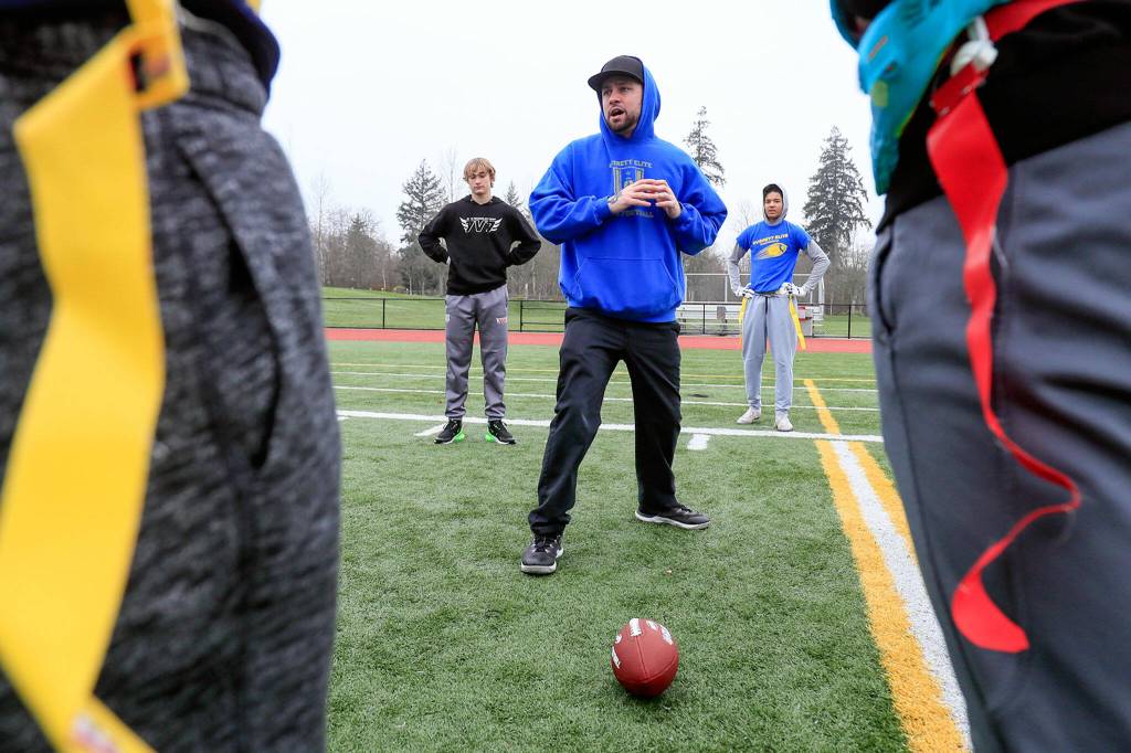 Jacob Hiatt, head coach, address the team during practice Jan. 16 at Harbour Pointe Middle School in Mukilteo. (Kevin Clark / The Herald)
