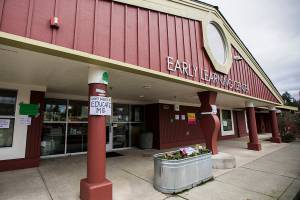 Signs hang on the outside of the Early Learning Center on the Everett Community College campus on Wednesday, Dec. 1, 2021 in Everett, Wa. (Olivia Vanni / The Herald)