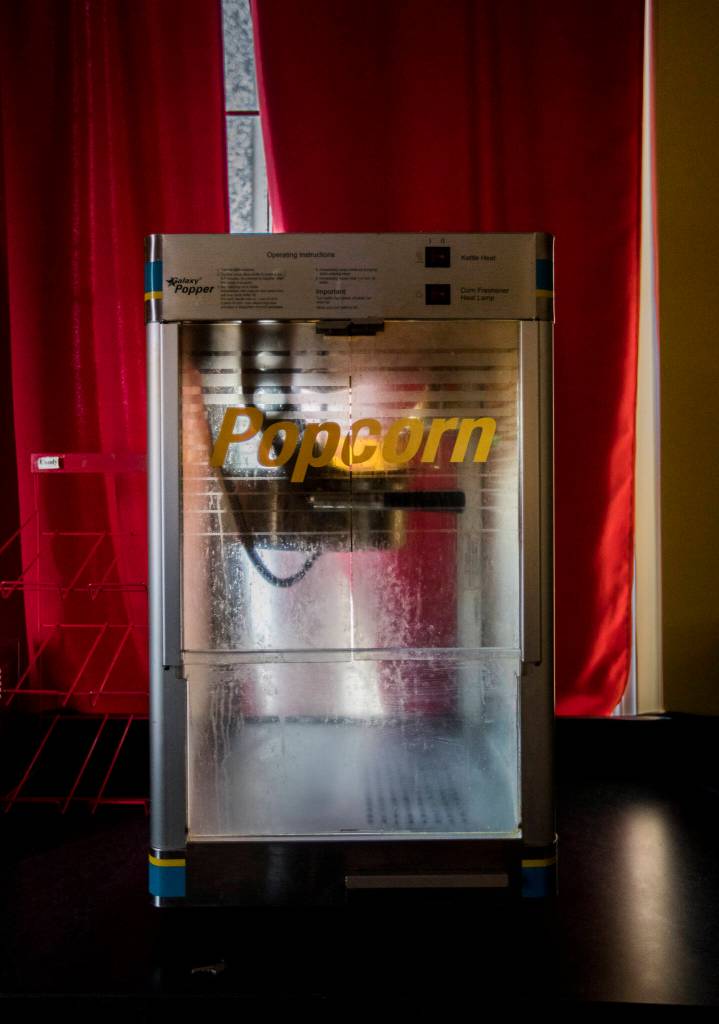 Oil coats the inside of an old popcorn machine at the Historic Everett Theatre. (Olivia Vanni / The Herald)