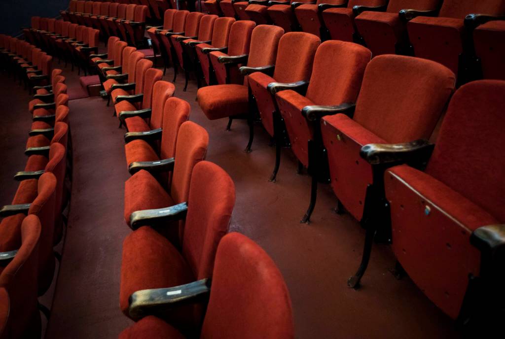 One velour covered chair hangs open at the Historic Everett Theatre. (Olivia Vanni / The Herald)