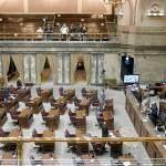 Members on the floor of the Washington State Senate stand during a moment of silence, Friday, Jan. 28, 2022, at the Capitol in Olympia, Wash., during a resolution honoring former state Sen. Doug Ericksen, R-Ferndale, who died on Dec. 17, 2021. (AP Photo/Ted S. Warren)