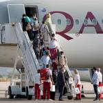 Afghan evacuees disembark the plane and board a bus after landing at Skopje International Airport, North Macedonia, on Sept. 15, 2021. (AP Photo/Boris Grdanoski, file)