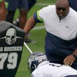 Seahawks defensive line and assistant head coach Clint Hurtt runs a drill during a practice on June 15, 2021, in Renton. (AP Photo/Ted S. Warren)