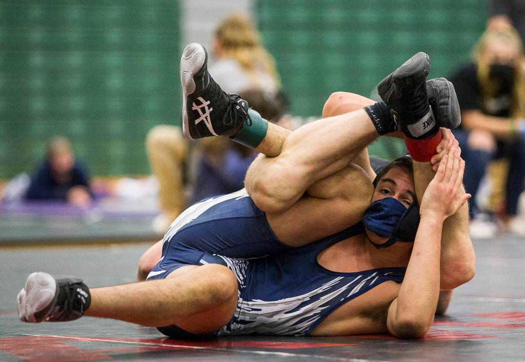 Glacier Peaks Urbano Torres tries to break free from Lake Stevens Tyler Flouts during a 4A sub-regional match on Saturday at Henry M. Jackson High School in Mill Creek. (Olivia Vanni / The Herald)