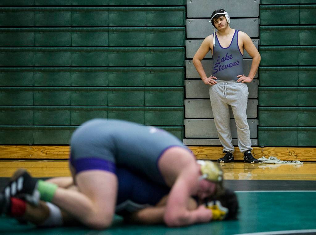 A Lake Stevens wrestler waits for his match during the 4A sub-regional tournament on Saturday at Henry M. Jackson High School in Mill Creek. (Olivia Vanni / The Herald)