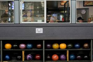 Diners sit inside Rocket Alley Bar & Grill in Arlington during lunchtime on Friday, Feb. 4, 2022. (Taylor Goebel  /  The Daily Herald)