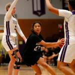 Kamiaks Vivian Mawudeku splits two defenders on her way to the basket against Lake Stevens Monday, Feb. 7, 2022, at Lake Stevens High School in Lake Stevens, Washington. (Ryan Berry / The Herald)