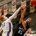 Lake Stevens’ Cori Wilcox records a block down low against Kamiak Monday, Feb. 7, 2022, at Lake Stevens High School in Lake Stevens, Washington. (Ryan Berry / The Herald)